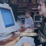 Woman in 1996 working on desktop computer.
