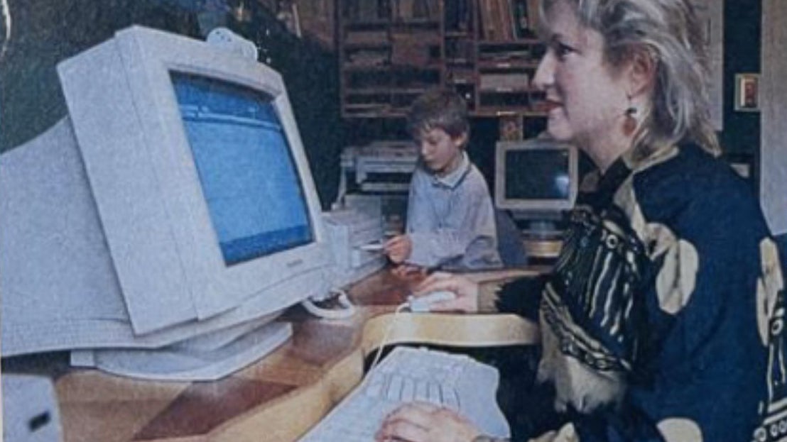 Woman in 1996 working on desktop computer.
