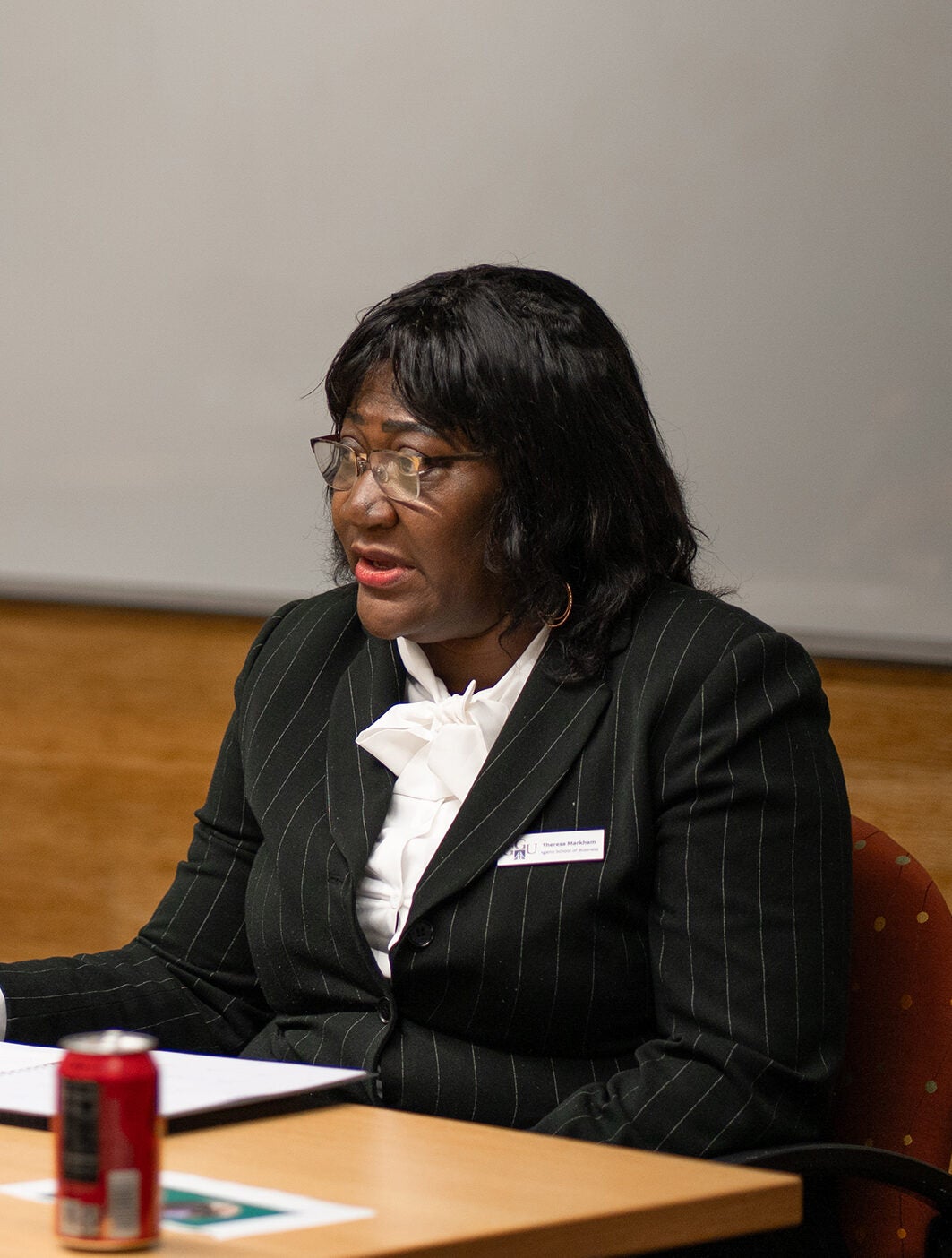 Theresa Markham speaks with student.