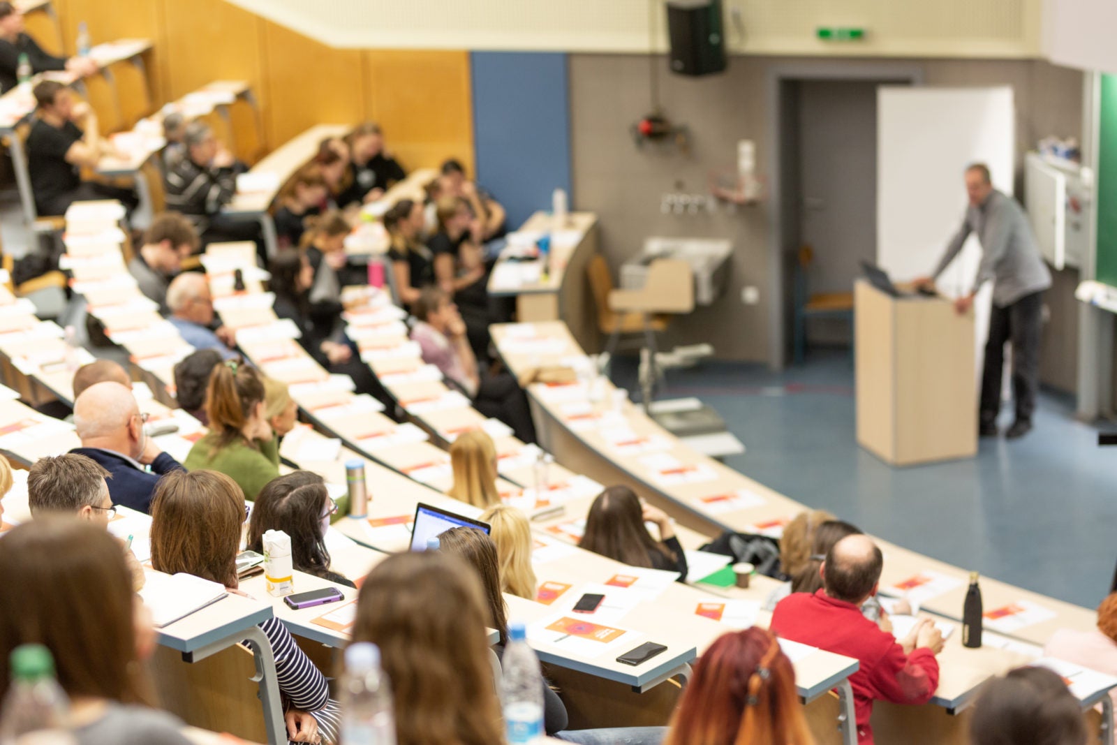 Students attend a lecture in one of the classroom halls at the GGU Parkmerced campus.