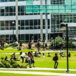 Campus life on GGU's Lake Merced Campus quad during a busy afternoon.