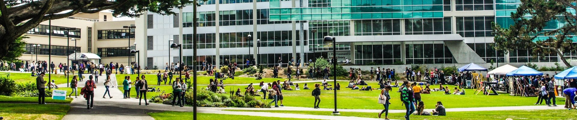 Campus life on GGU's Lake Merced Campus quad during a busy afternoon.